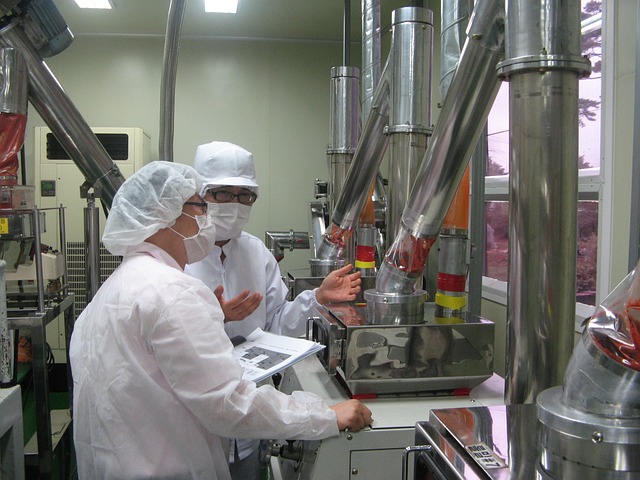 Workers in food processing plant with sophisticated industrial ventilation systems
