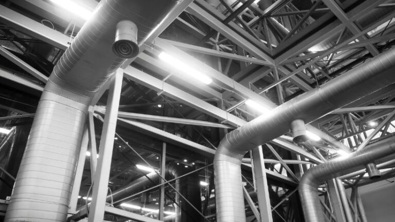 Industrial ventilation system piping in large industrial space