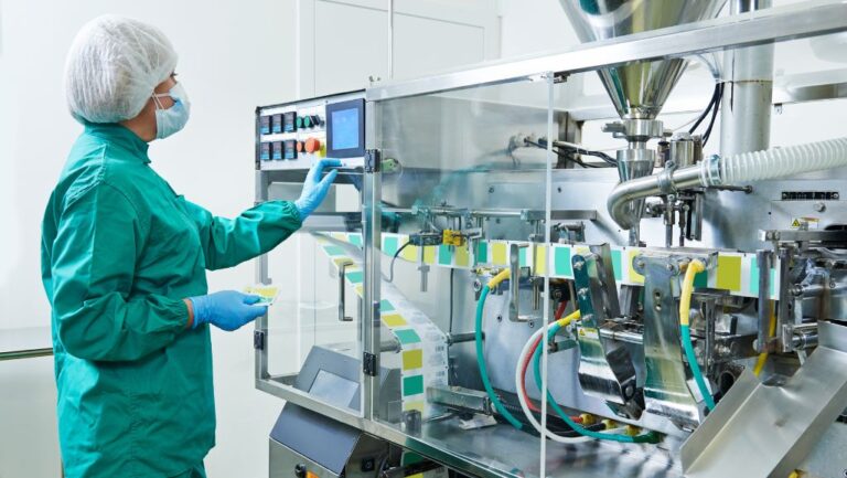 employee in pharmaceutical production plant protected by clean environment ventilation