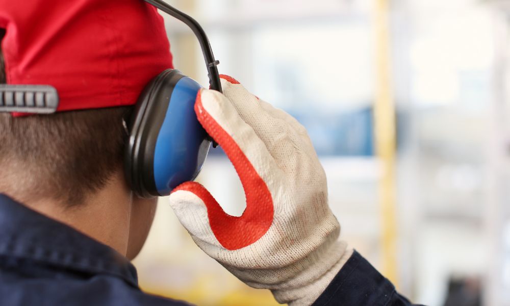 worker wearing hearing protection as part of ventilation system noise control