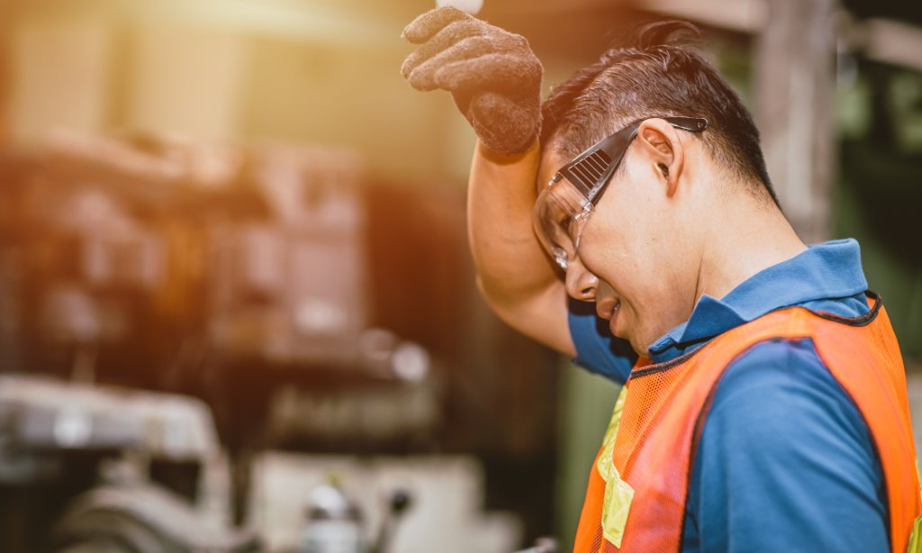 worker feeling overly hot due to poorly performing industrial ventilation systems